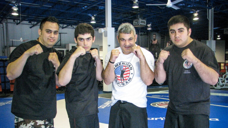 Martial arts instructor training with his brothers at American Top Team